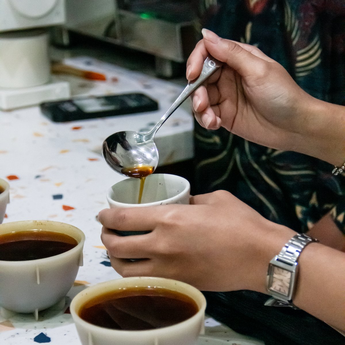 Pouring each sample for the day's cupping session